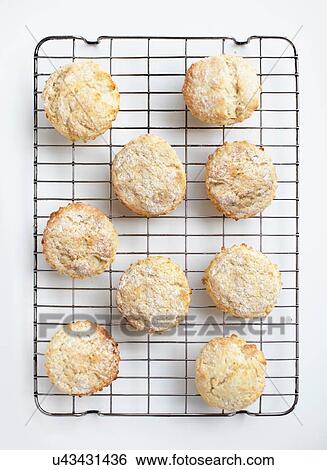 Stock Photograph - Overhead view of freshly baked scones on cooling rack. Fotosearch