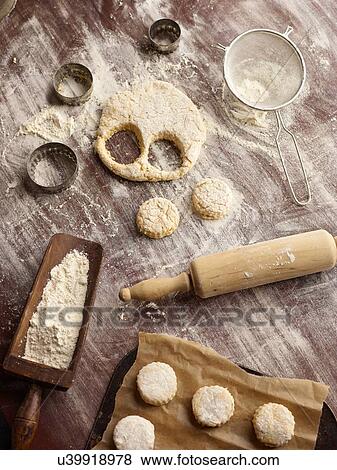 Overhead view of scone dough and pastry cutters View Large Photo Image Stock Photo - Overhead view of scone dough and pastry cutters. Fotosearch