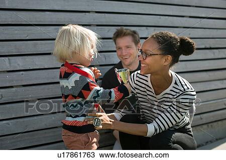 Parents and their son with a trophy View Large Photo Image Stock Image - Parents and their son with a trophy. Fotosearch