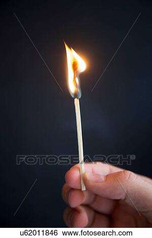 Person holding burning match View Large Photo Image Stock Photograph - Person holding burning match. Fotosearch