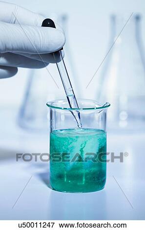 Stock Photo - Pipette adding sodium carbonate to nickel sulfate. Both solutions 0. 5 M concentration. Nickel carbonate precipitate is formed result: NiSO4 + Na2CO3 -> Na2SO4 + NiCO3 Double displacement reaction. Fotosearch
