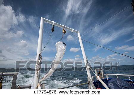 Stock Photograph - Plankton net hanging on stern of research ship. Fotosearch