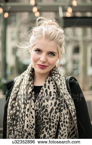 Portrait of beautiful young woman wearing leopard print scarf View Large Photo Image Stock Photograph - Portrait of beautiful young woman wearing leopard print scarf. Fotosearch