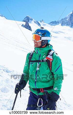 Stock Photo - Portrait of mature male skier on Mont Blanc massif, Graian Alps, France. Fotosearch