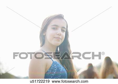 Portrait of pretty long haired teenage girl in park View Large Photo Image Stock Photo - Portrait of pretty long haired teenage girl in park. Fotosearch