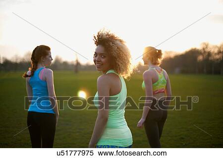 Portrait of three women exercising in the park View Large Photo Image Stock Photography - Portrait of three women exercising in the park. Fotosearch
