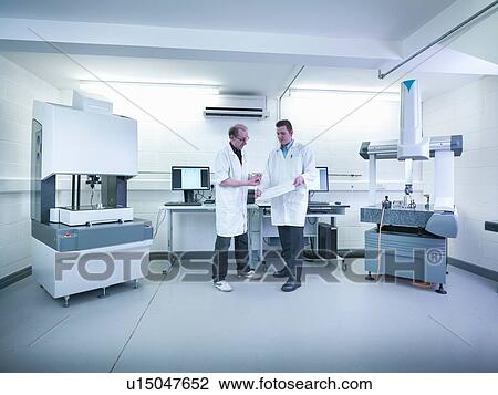 Quality control engineers in discussion amongst measuring machinery View Large Photo Image Stock Image - Quality control engineers in discussion amongst measuring machinery. Fotosearch