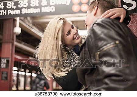 Romantic couple hugging on New York City subway platform, New York, USA View Large Photo Image Stock Photo - Romantic couple hugging on New York City subway platform, New York, USA. Fotosearch