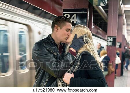 Romantic young couple kissing on New York City subway platform, New York, USA View Large Photo Image Stock Image - Romantic young couple kissing on New York City subway platform, New York, USA. Fotosearch