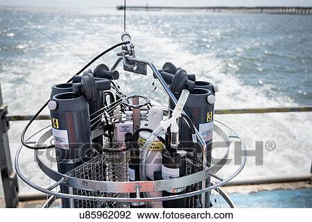 Stock Image - Sea water sampling experiment on stern of research ship. Fotosearch