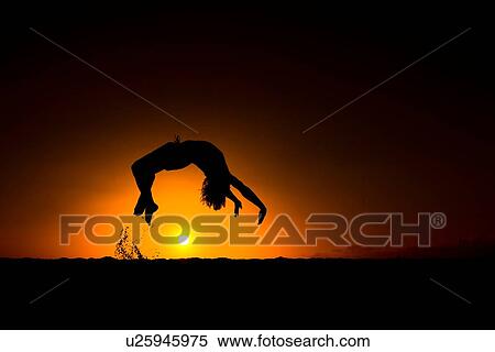 Silhouette of man doing back flip, at sunset, Omakaha, Oahu, Hawaii View Large Photo Image Stock Photography - Silhouette of man doing back flip, at sunset, Omakaha, Oahu, Hawaii. Fotosearch