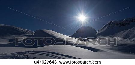 Stock Image - Snow-covered landscape at sunset, Flaine, France. Fotosearch