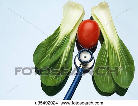 Stethoscope on a medical tray with a tomato and pak choi to illustrate healthy lungs and heart View Large Photo Image Picture - Stethoscope on a medical tray with a tomato and pak choi to illustrate healthy lungs and heart. Fotosearch