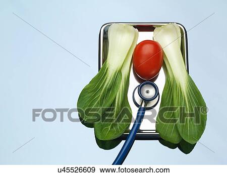 Stethoscope on medical tray with a tomato and pak choi illustrating healthy lungs and heart View Large Photo Image Stock Photo - Stethoscope on medical tray with a tomato and pak choi illustrating healthy lungs and heart. Fotosearch