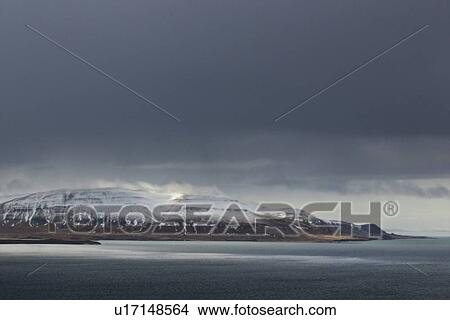 Storm cloud over fjord and snow capped mountain, Hvalfjorour, Iceland View Large Photo Image Picture - Storm cloud over fjord and snow capped mountain, Hvalfjorour, Iceland. Fotosearch