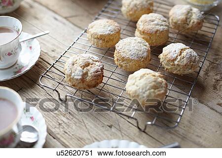 Table with fresh scones and tea View Large Photo Image Stock Image - Table with fresh scones and tea. Fotosearch