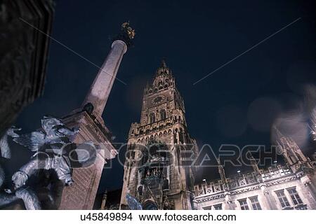 Picture - The New Rathaus (Town Hall) and statue at night, Munich, Germany. Fotosearch