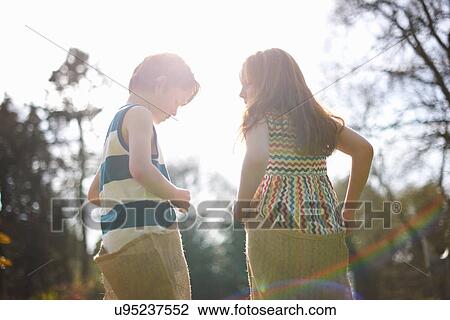 Two young children having sack race View Large Photo Image Stock Image - Two young children having sack race. Fotosearch
