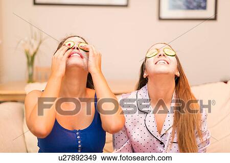 Two young women wearing face masks View Large Photo Image Stock Photo - Two young women wearing face masks. Fotosearch