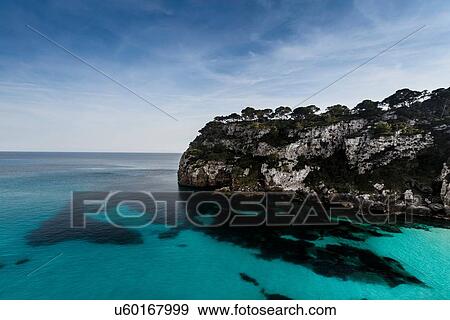 Stock Photo - View of Cala Macarella and Macarelleta, Menorca, Spain. Fotosearch