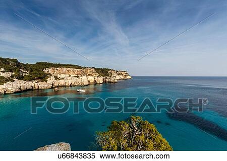 View of Cala Macarella and sailboat, Menorca, Spain View Large Photo Image Stock Photography - View of Cala Macarella and sailboat, Menorca, Spain. Fotosearch