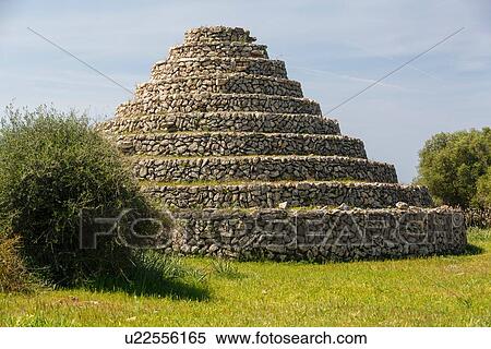 Stock Photography - View of circular stepped ancient Talayotic building, Menorca, Spain. Fotosearch