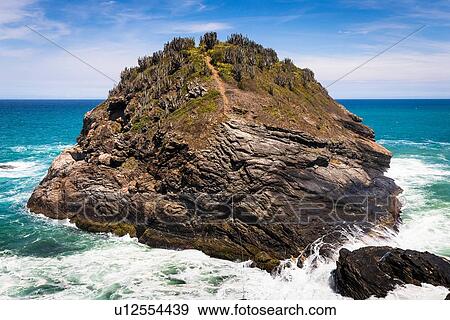 Stock Photo - View of coastal rock formation, Lagoinha, Buzios, Rio de Janeiro, Brazil. Fotosearch