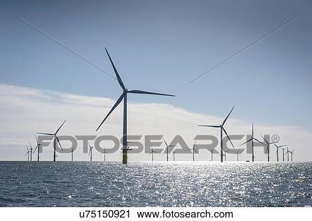 Stock Image - View of offshore windfarm from service boat at sea. Fotosearch