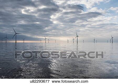 Stock Photo - View of offshore windfarm from service boat at sea. Fotosearch