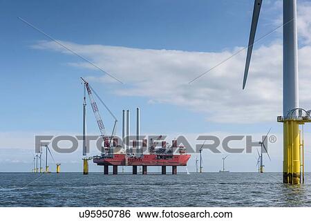 View of offshore windfarm with construction ship View Large Photo Image Stock Photograph - View of offshore windfarm with construction ship. Fotosearch