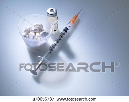 White tablets in plastic measuring cup with syringe and drug vial View Large Photo Image Stock Photo - White tablets in plastic measuring cup with syringe and drug vial. Fotosearch