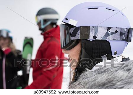 Woman wearing helmet and ski goggles View Large Photo Image Stock Image - Woman wearing helmet and ski goggles. Fotosearch