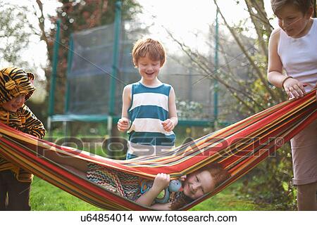 Picture - Young children playing in garden. Fotosearch