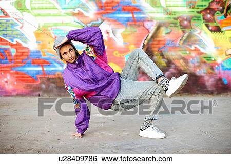 Young woman breakdancing freeze against graffiti View Large Photo Image Stock Photograph - Young woman breakdancing freeze against graffiti. Fotosearch