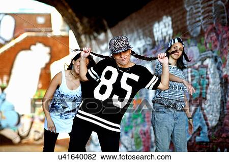 Young woman dancing, looking at camera with attitude View Large Photo Image Stock Image - Young woman dancing, looking at camera with attitude. Fotosearch