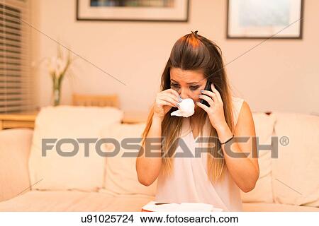 Young woman having telephone conversation, crying View Large Photo Image Picture - Young woman having telephone conversation, crying. Fotosearch