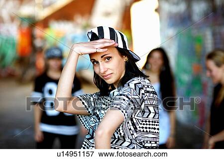 wearing baseball cap backwards