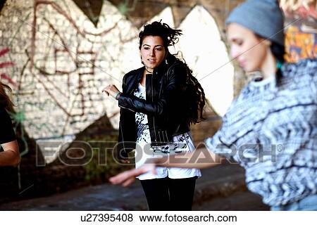 Young women dancing in the street View Large Photo Image Stock Photo - Young women dancing in the street. Fotosearch