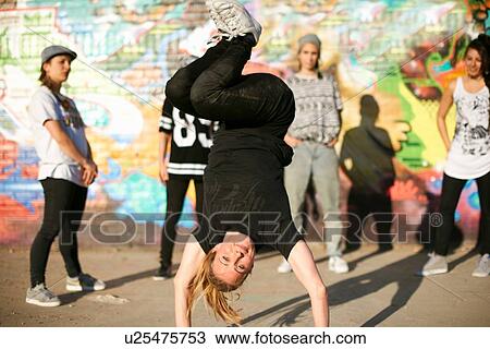 Young women in a breakdancing handstand freeze View Large Photo Image Stock Image - Young women in a breakdancing handstand freeze. Fotosearch