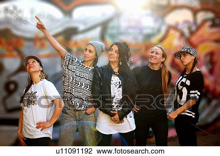 Young women in a row, looking away View Large Photo Image Stock Image - Young women in a row, looking away. Fotosearch