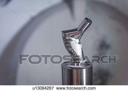 Artificial hip joint in CNC lathe in orthopaedic factory, close up View Large Photo Image Stock Photo - Artificial hip joint in CNC lathe in orthopaedic factory, close up. Fotosearch