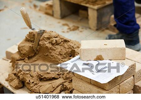 Cement, brick stack and blueprint on top of pallet View Large Photo Image Stock Photo - Cement, brick stack and blueprint on top of pallet. Fotosearch