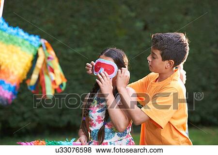 Children playing pinata in garden View Large Photo Image Stock Photo - Children playing pinata in garden. Fotosearch