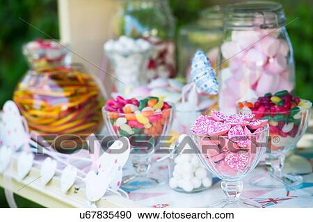 Confectionery in glasses and jars, close-up View Large Photo Image Stock Image - Confectionery in glasses and jars, close-up. Fotosearch