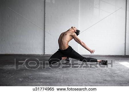 Stock Photography - Dancer practising in studio. Fotosearch