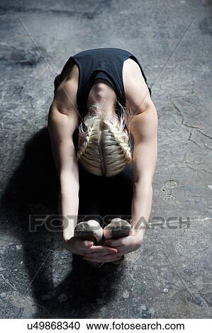 Dancer stretching in studio View Large Photo Image Stock Image - Dancer stretching in studio. Fotosearch