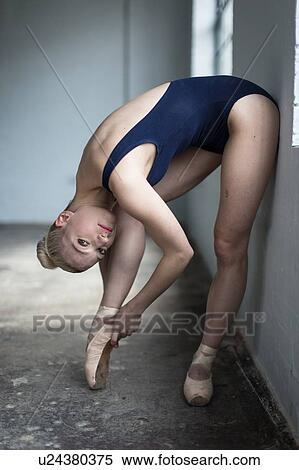 Dancer stretching in studio View Large Photo Image Stock Photography - Dancer stretching in studio. Fotosearch