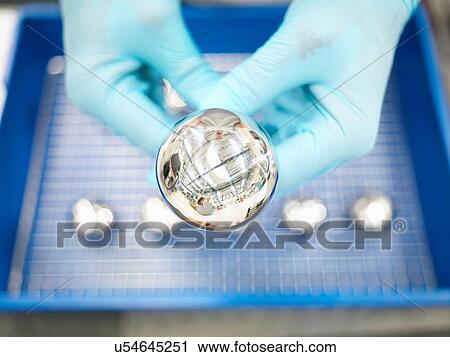 Stock Image - Detail of artificial hip joint in orthopaedic factory, close up. Fotosearch