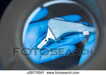 Engineer inspecting artificial hip joint through magnifier in orthopaedic factory, close up View Large Photo Image Stock Image - Engineer inspecting artificial hip joint through magnifier in orthopaedic factory, close up. Fotosearch