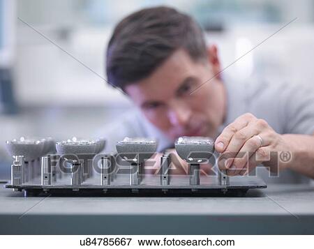 Engineer inspecting artificial hip joint parts in quality control department in orthopaedic factory View Large Photo Image Stock Photo - Engineer inspecting artificial hip joint parts in quality control department in orthopaedic factory. Fotosearch